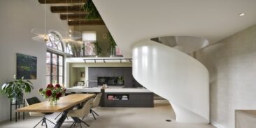 Treppen als verbindendes Element: Transformation eines historischen Klinikbaus in zeitgemäßen Wohnraum